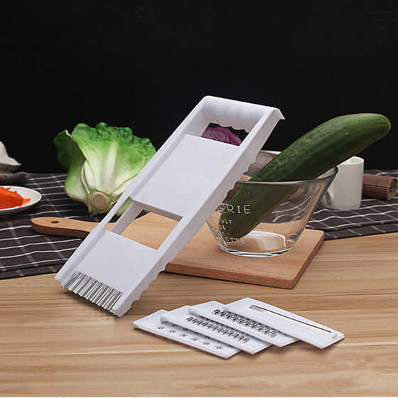 Home Kitchen multifunctional kitchen grater featuring multiple slicing options and a sleek design.