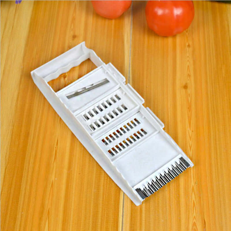 Home Kitchen Multifunctional Grater showing a modern vegetable cutter on a wooden surface.
