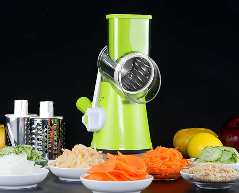 Manual Kitchen Accessories Multifunctional Round Mandoline Potato Slicer Vegetable Cutter Slicer Cheese Kitchen Gadgets in green color with sliced vegetables.