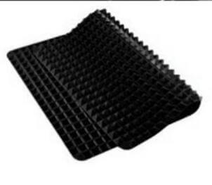 Non-Stick Silicone Cooking Mat in black with raised pyramid design for even cooking and less sticking.