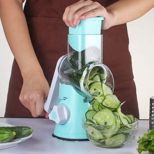 Manual kitchen accessories with multifunctional mandoline slicer kitchen gadget slicing cucumbers.