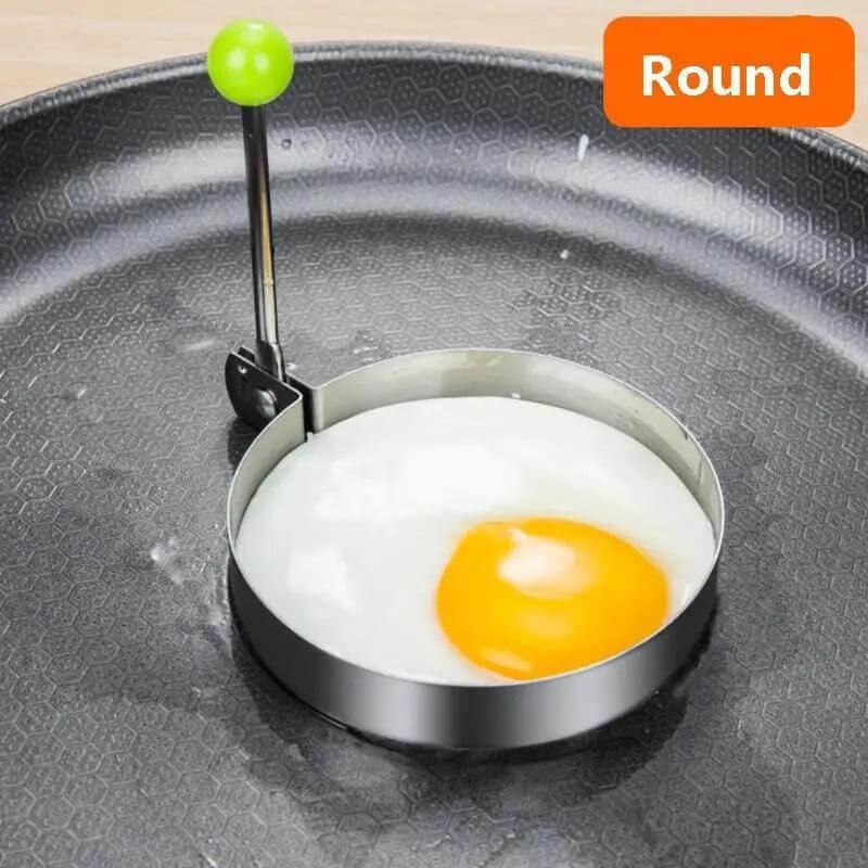 5Pcs Stainless Steel Fried Egg Mold Pancake Mould Omelette Mold Ring Cooking Fried Egg Bento Shaper Kitchen Gadget Frying Egg Cooking Tools Kitchen Accessories Gadget Rings with round egg in frying pan.