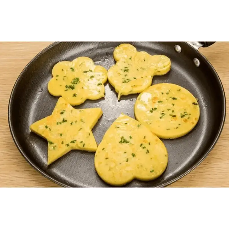 5Pcs Stainless Steel Fried Egg Mold Pancake Mould Omelette Mold Ring Cooking Fried Egg Bento Shaper Kitchen Gadget Frying Egg Cooking Tools Kitchen Accessories Gadget Rings with playful shapes in a frying pan.