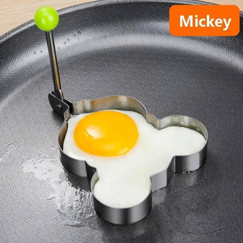 5Pcs Stainless Steel Fried Egg Mold Pancake Mould Omelette Mold Ring Cooking Fried Egg Bento Shaper Kitchen Gadget Frying Egg Cooking Tools Kitchen Accessories Gadget Rings in use with a Mickey Mouse shape.