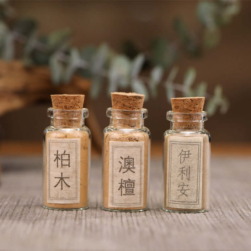 Pure copper incense set featuring assorted fragrant powder jars with cork lids on a wooden surface.