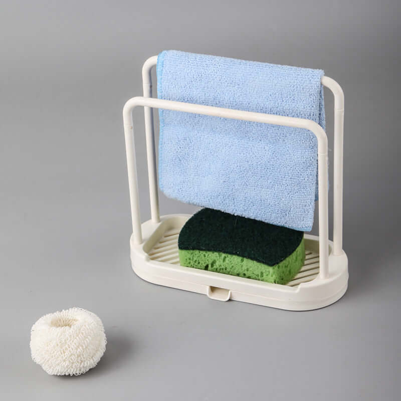 Multi-purpose kitchen drain rack with towels and sponges for optimal kitchen organization.