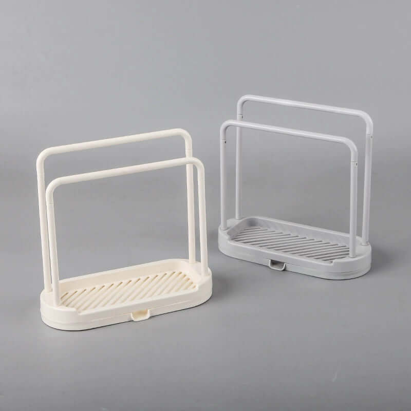 Two multi-purpose kitchen drain racks in gray and white colors on a gray background.