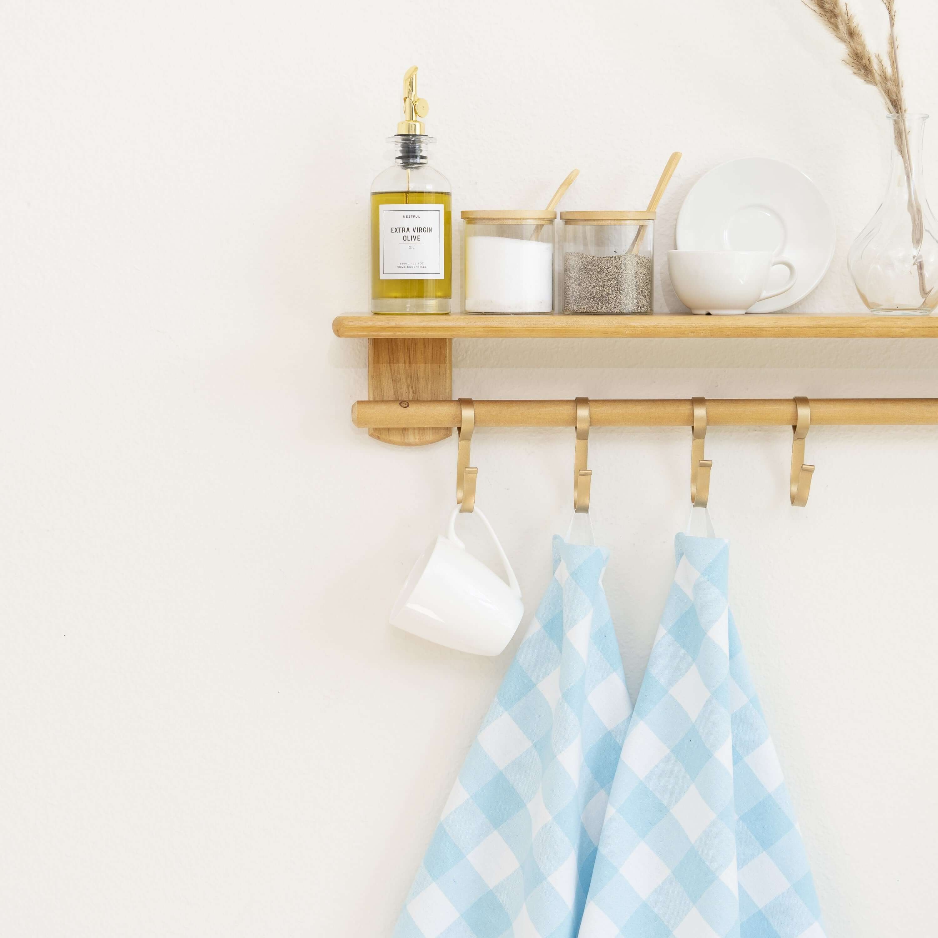 Plaid Kitchen Towels hanging in a bright kitchen setting, showcasing their stylish blue plaid design and functionality.