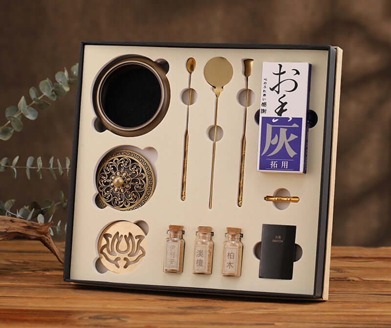 Pure copper incense set showcasing glossy bamboo burner, tools, and essential oils in a beautifully arranged box.