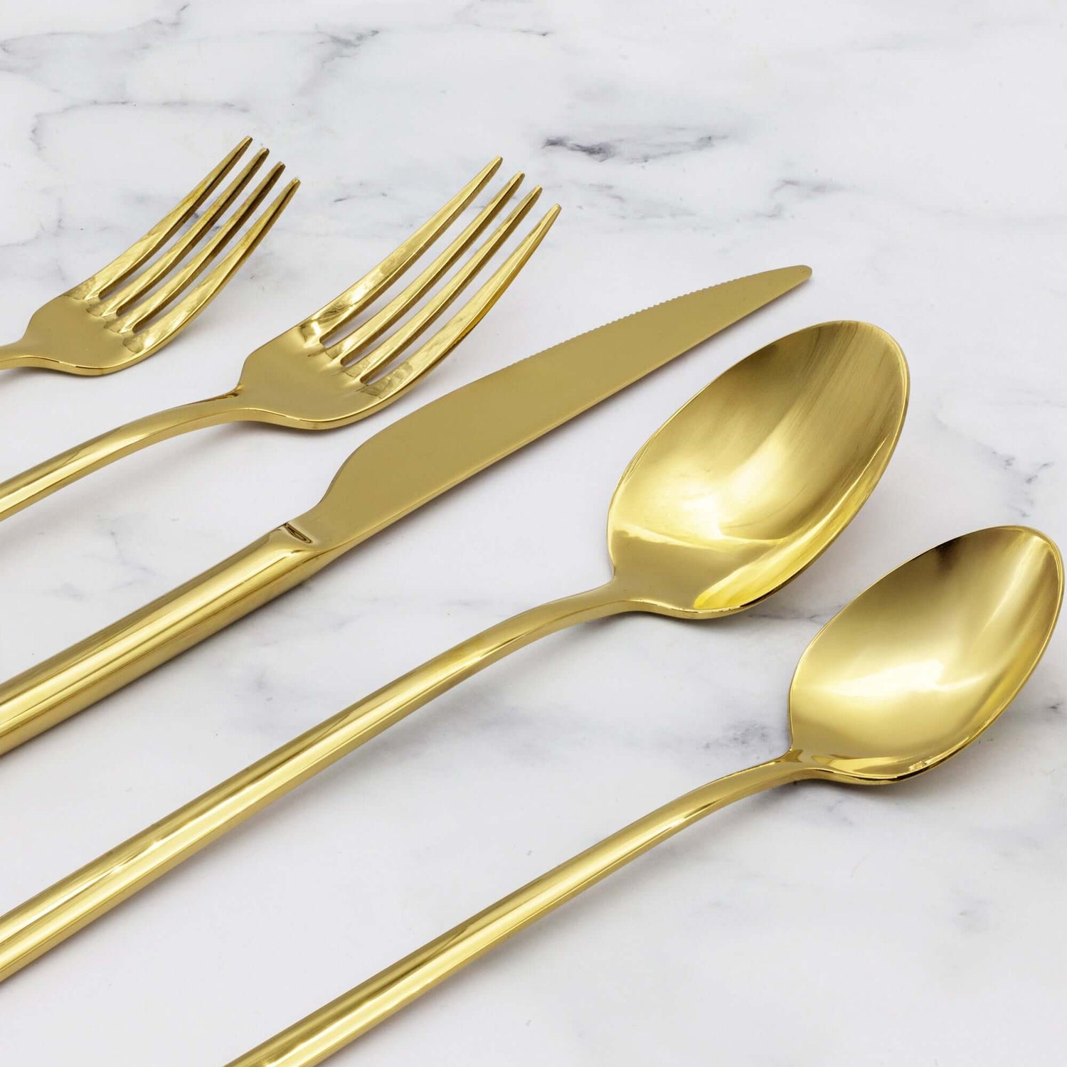 Emilia Mirror 20-Piece Flatware Set displayed with golden forks, knife, and spoons on marble background.