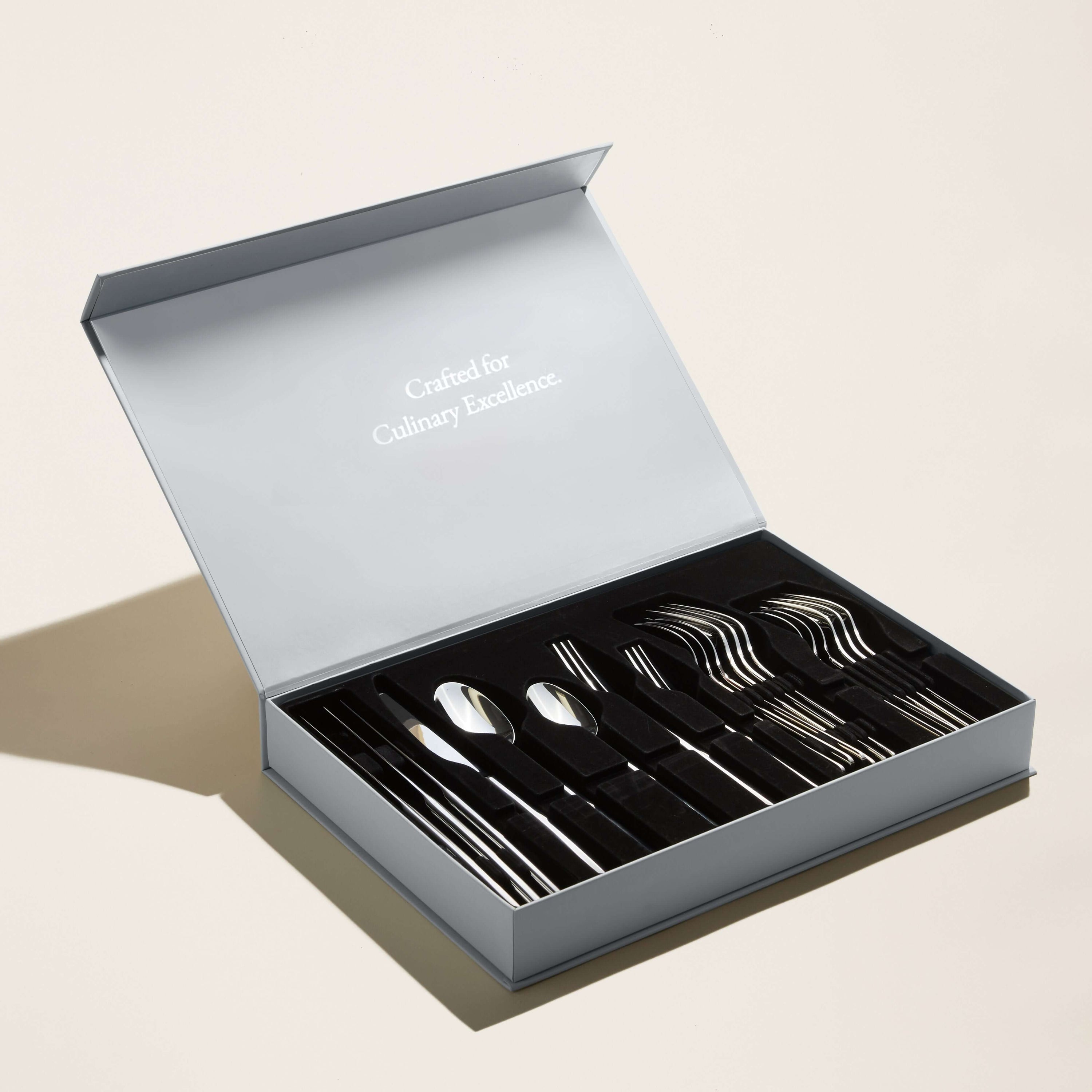 Emilia Mirror 20-Piece Flatware Set displayed in a sleek box emphasizing culinary excellence.