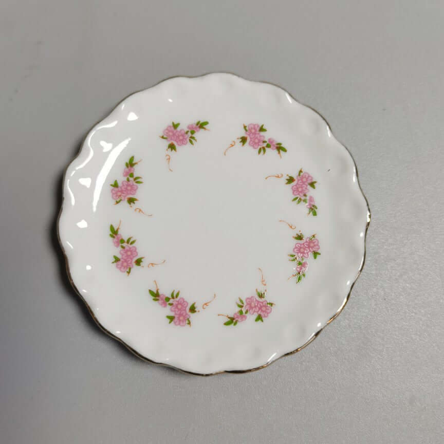 Miniature Kitchen Accessories ceramic plate with pink flower design, scalloped edge, 5-6cm size.