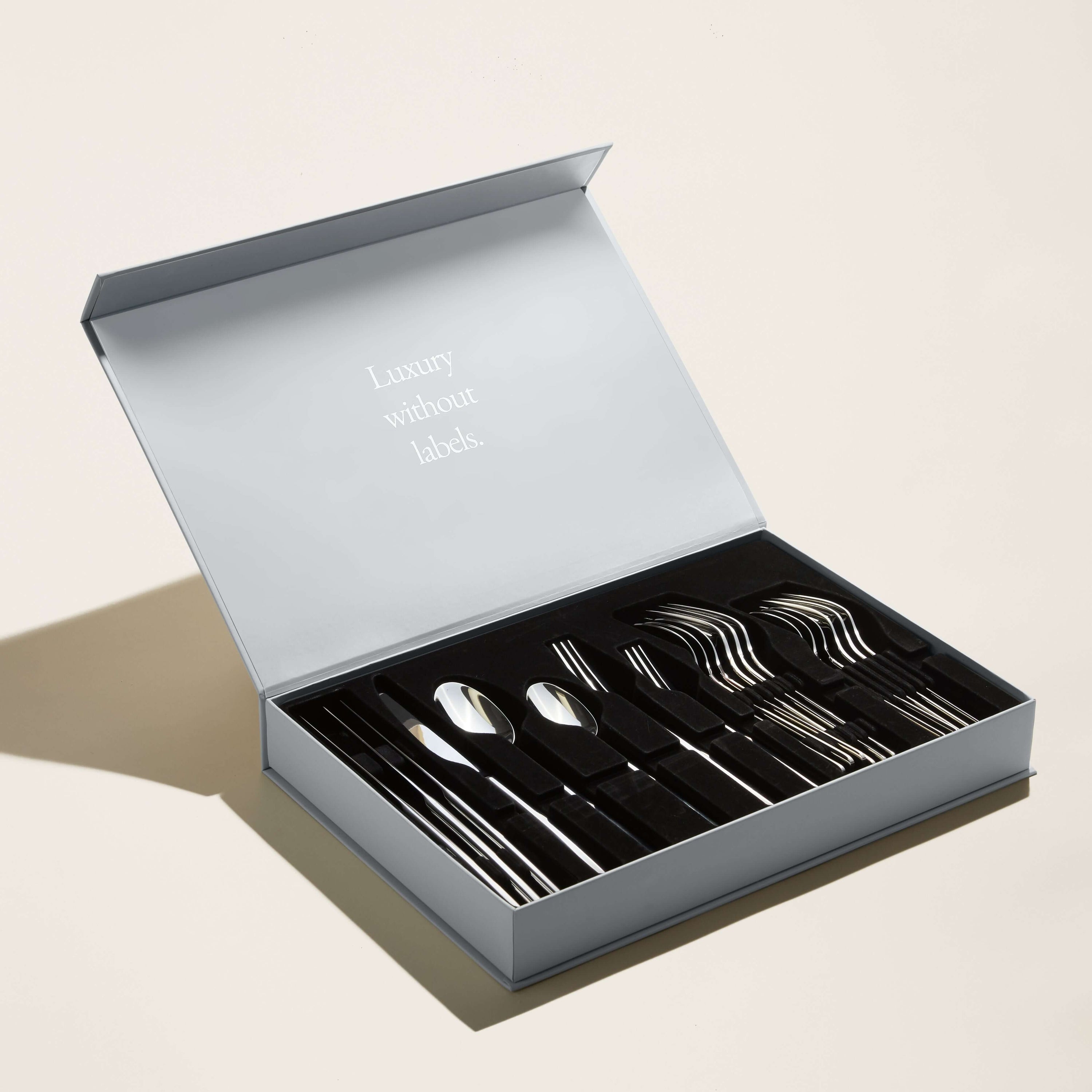 Emilia Mirror 20-Piece Flatware Set presented in an elegant box with the phrase &