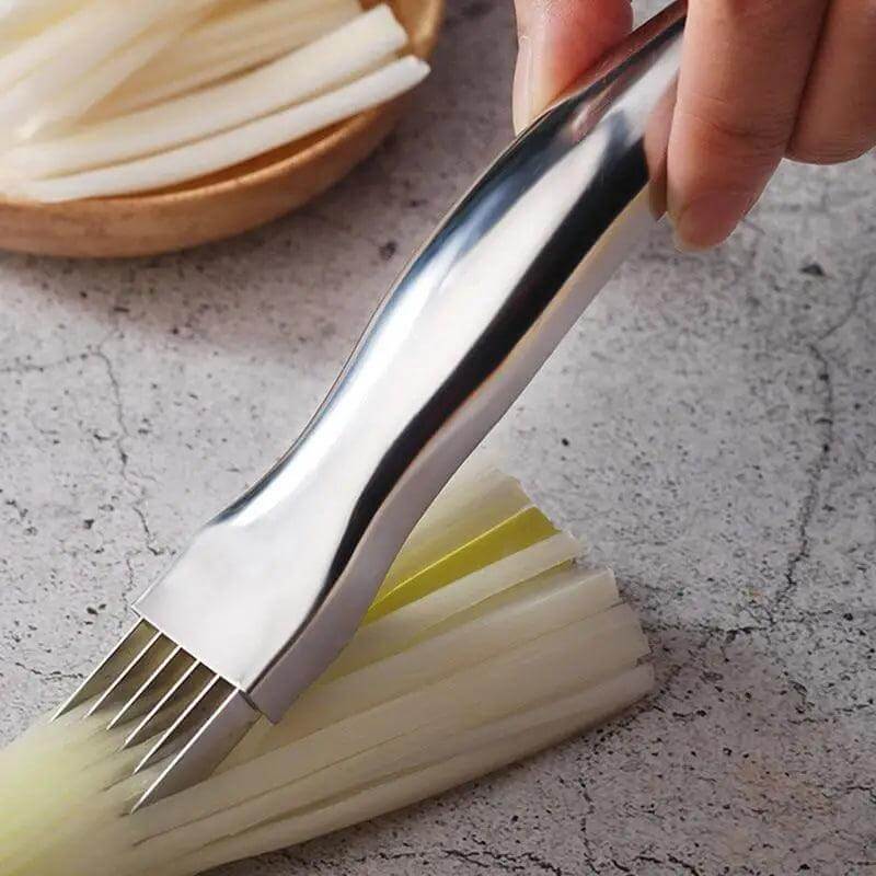 Stainless SteelcVegetable Cutter slicing through neatly chopped green onions on a kitchen counter.