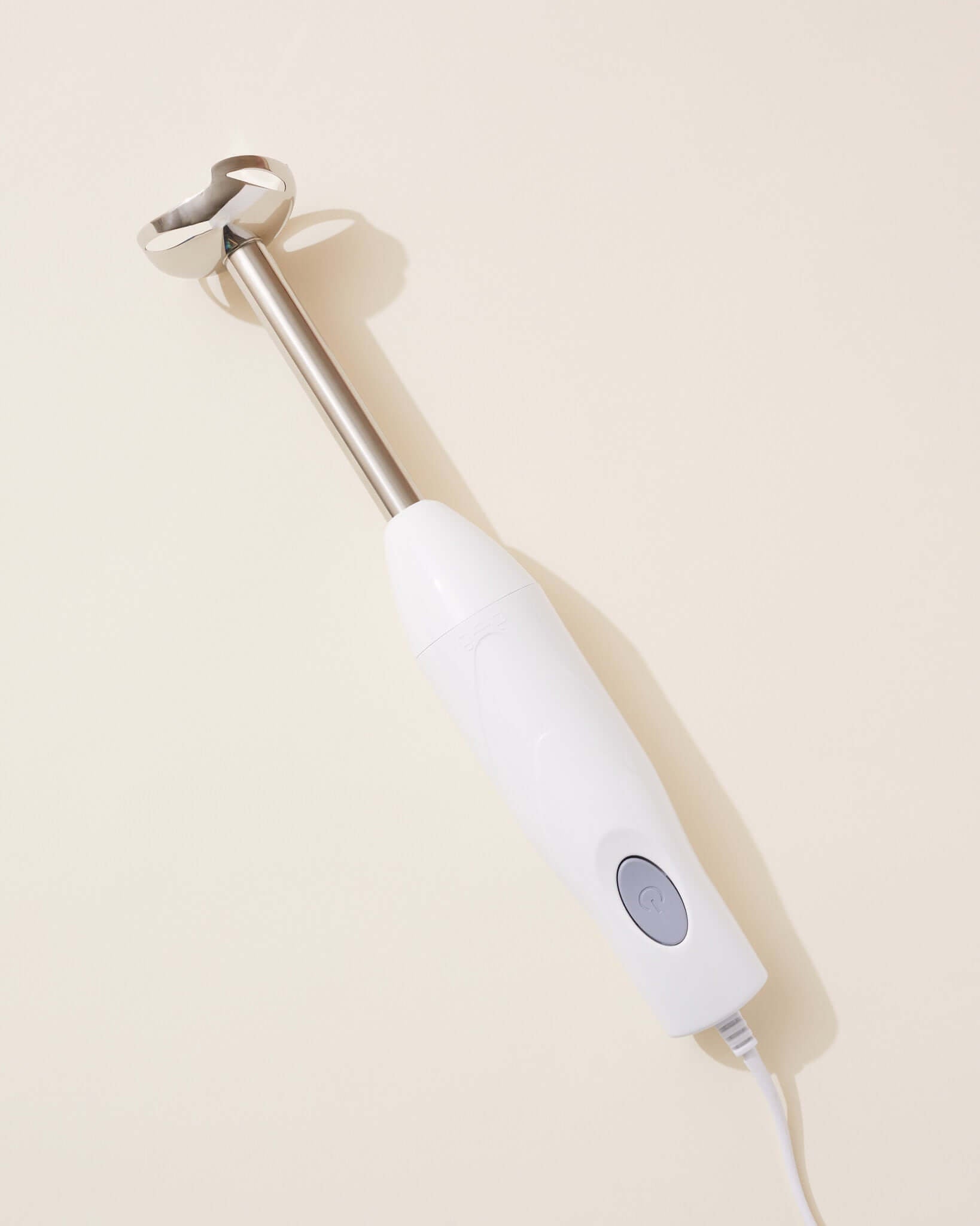 White Hand Held Blender on a light background, perfect for soups, smoothies, and sauces.